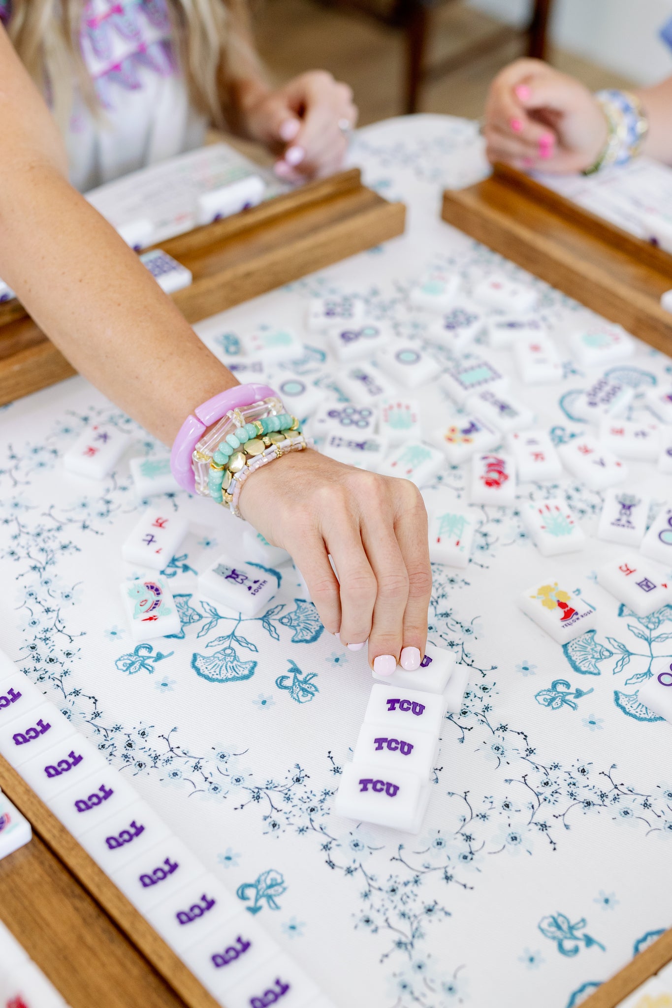 mahjong player wears bracelet stack
