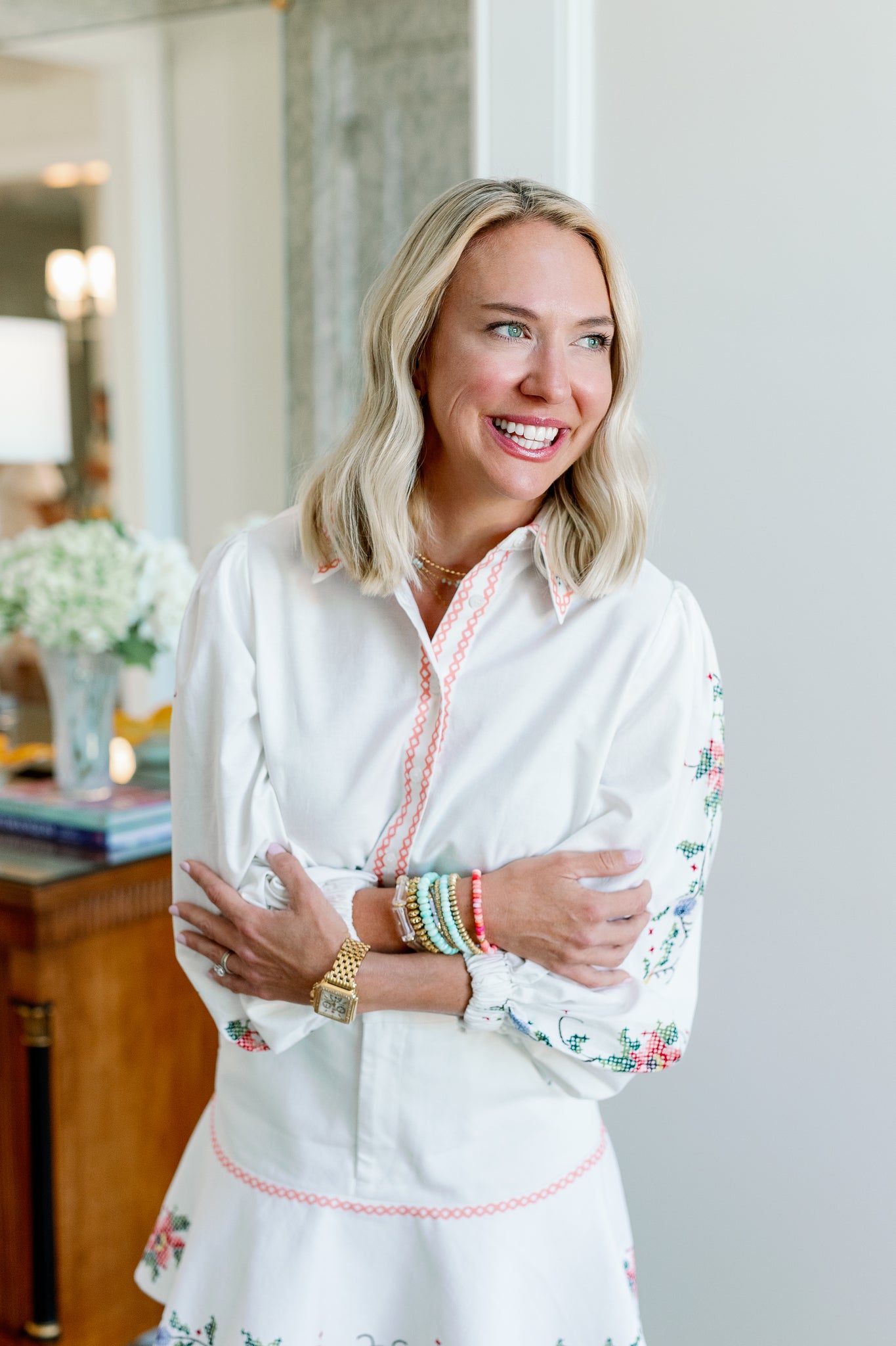 becca, the creator behind baubles Becca, is wearing a dynamic stack of beaded bracelets