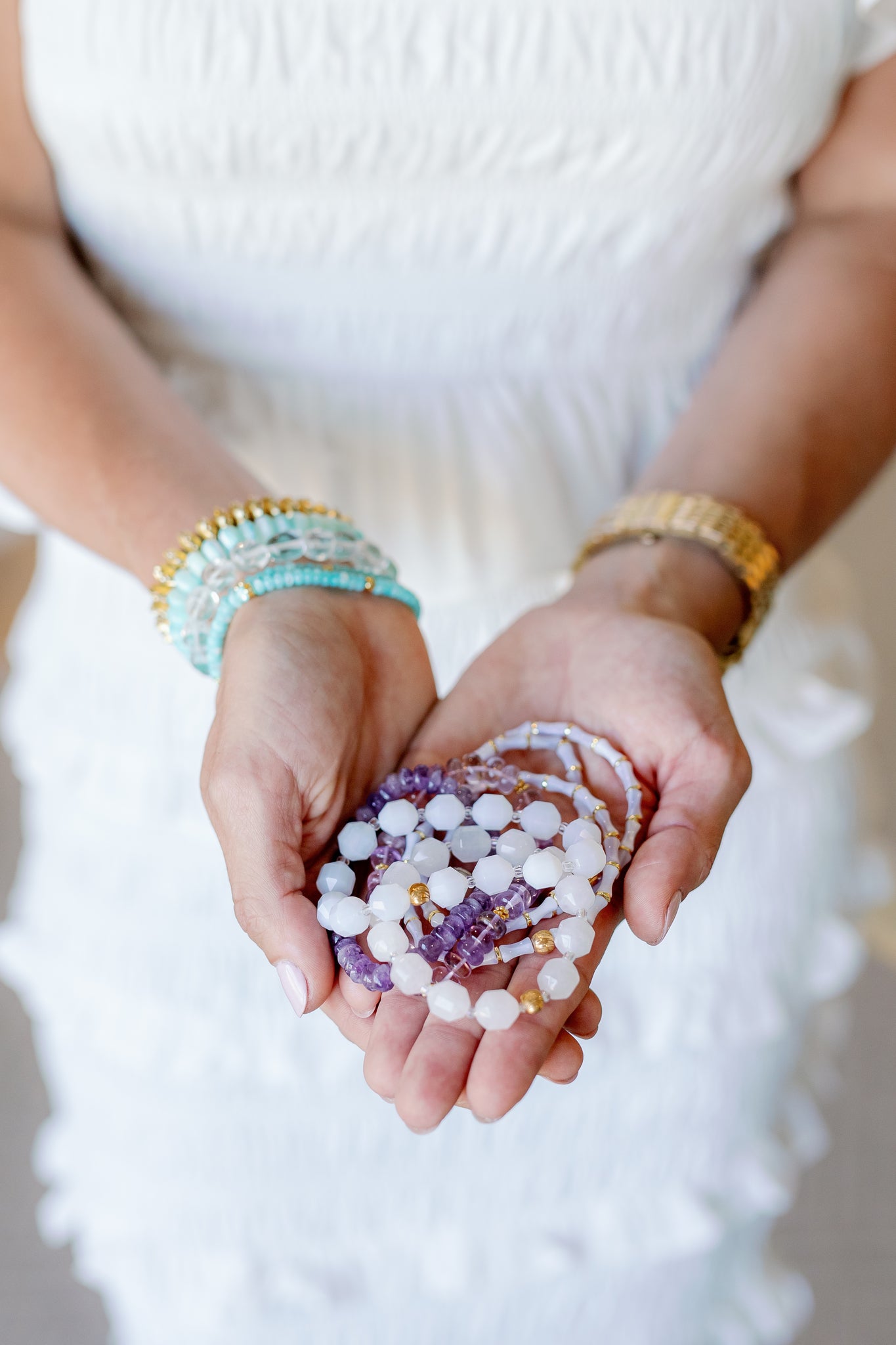 white and purple bracelets 