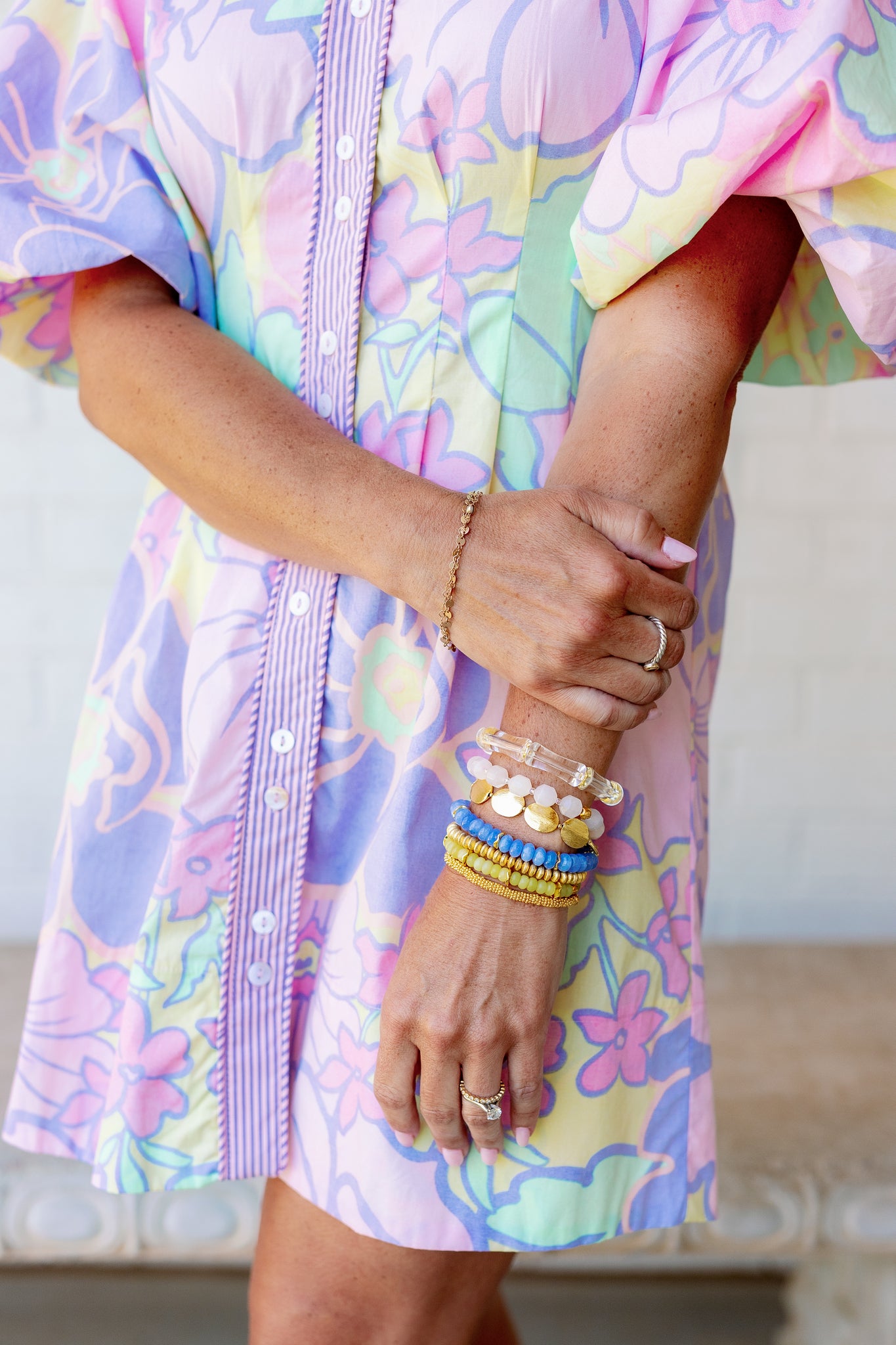 blue, gold, and green bracelets