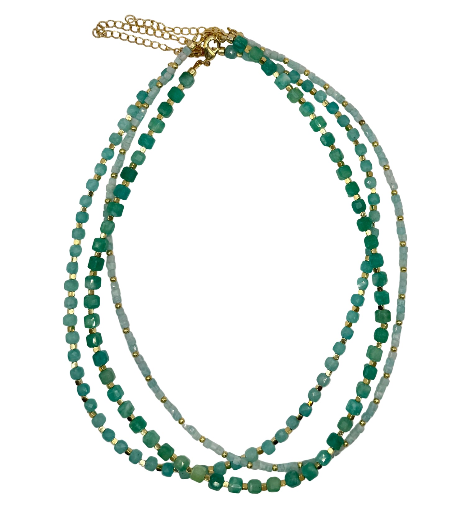 Multistrand necklace with green beads and gold accents on a light gray background