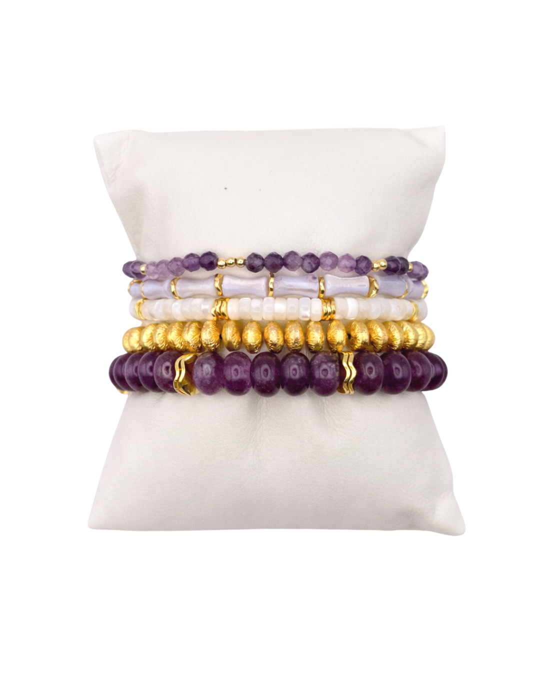 Set of purple and gold beaded bracelets.